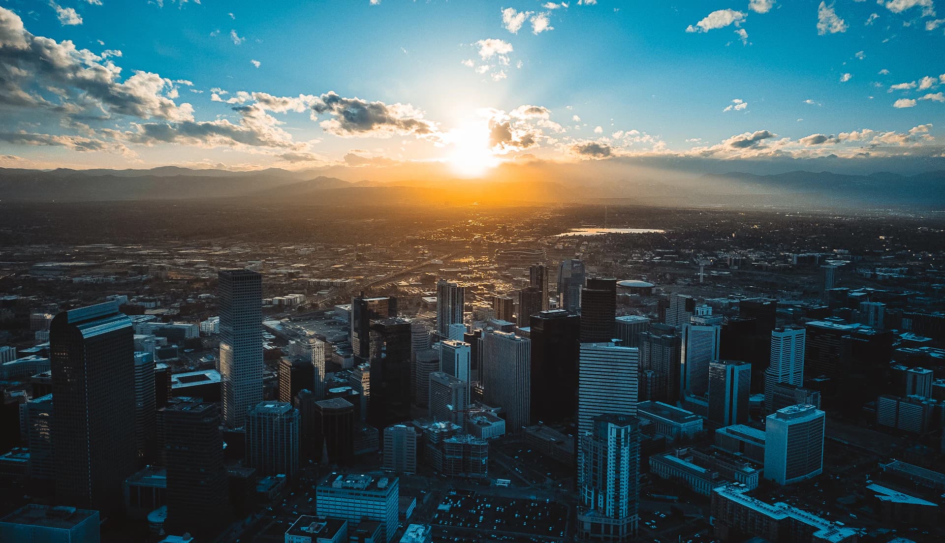 Denver’s skyline and the Rocky Mountains at sunset